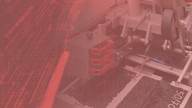 Maszyna przemysłowa z elementami mechanicznymi i cyfrowym wzorem. Kontekst: produkcja, technologia.