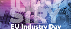 Grafika z napisem "INDUSTRY EU Industry Day 21 February 2018". Kluczowe obiekty: koła zębate, ludzie w tle.