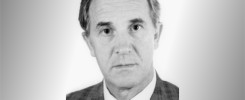 Portret mężczyzny w garniturze i krawacie. Tło gradientowe.